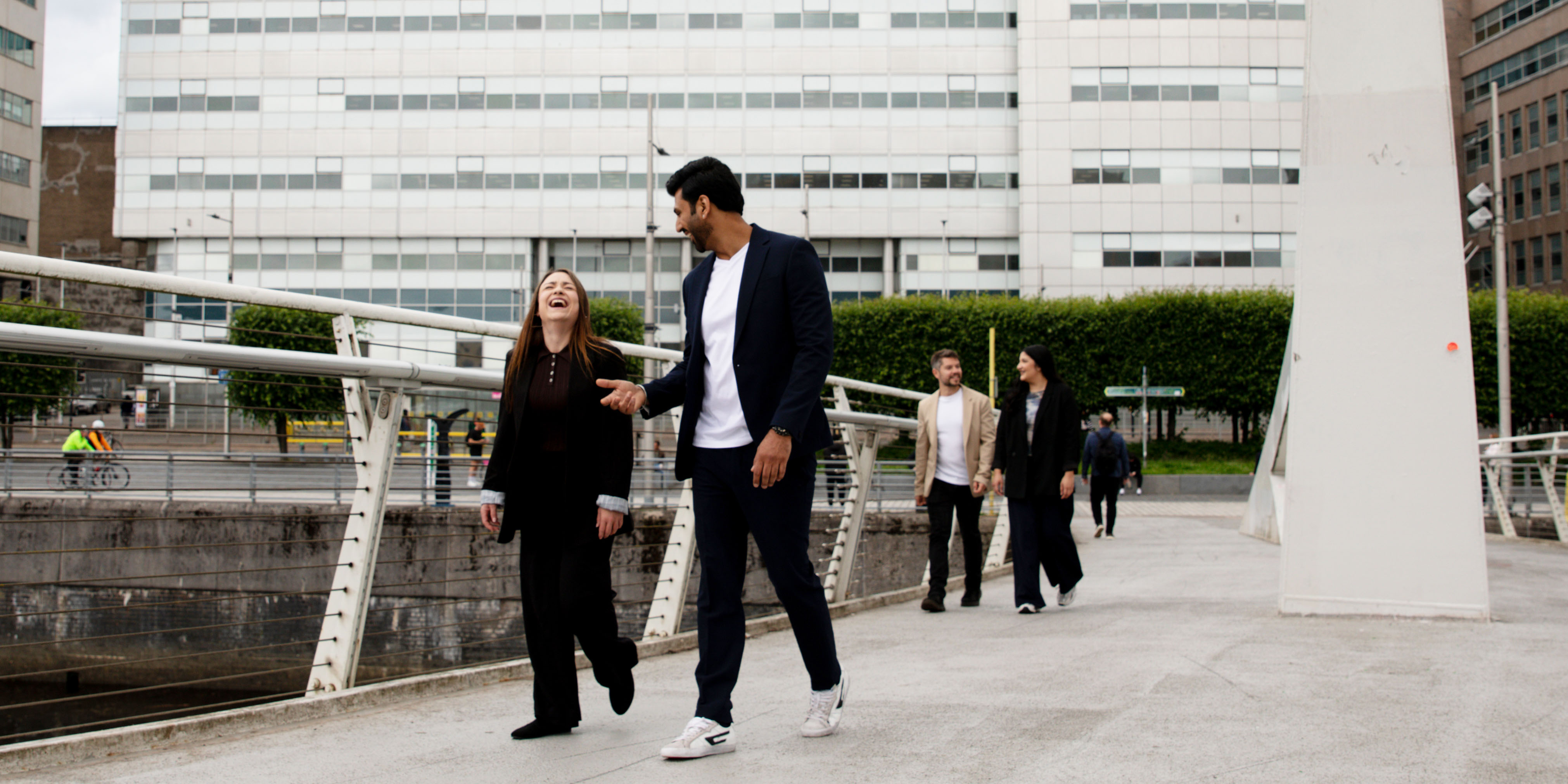 Colleagues walking along the River Clyde Colleagues walking along the River Clyde